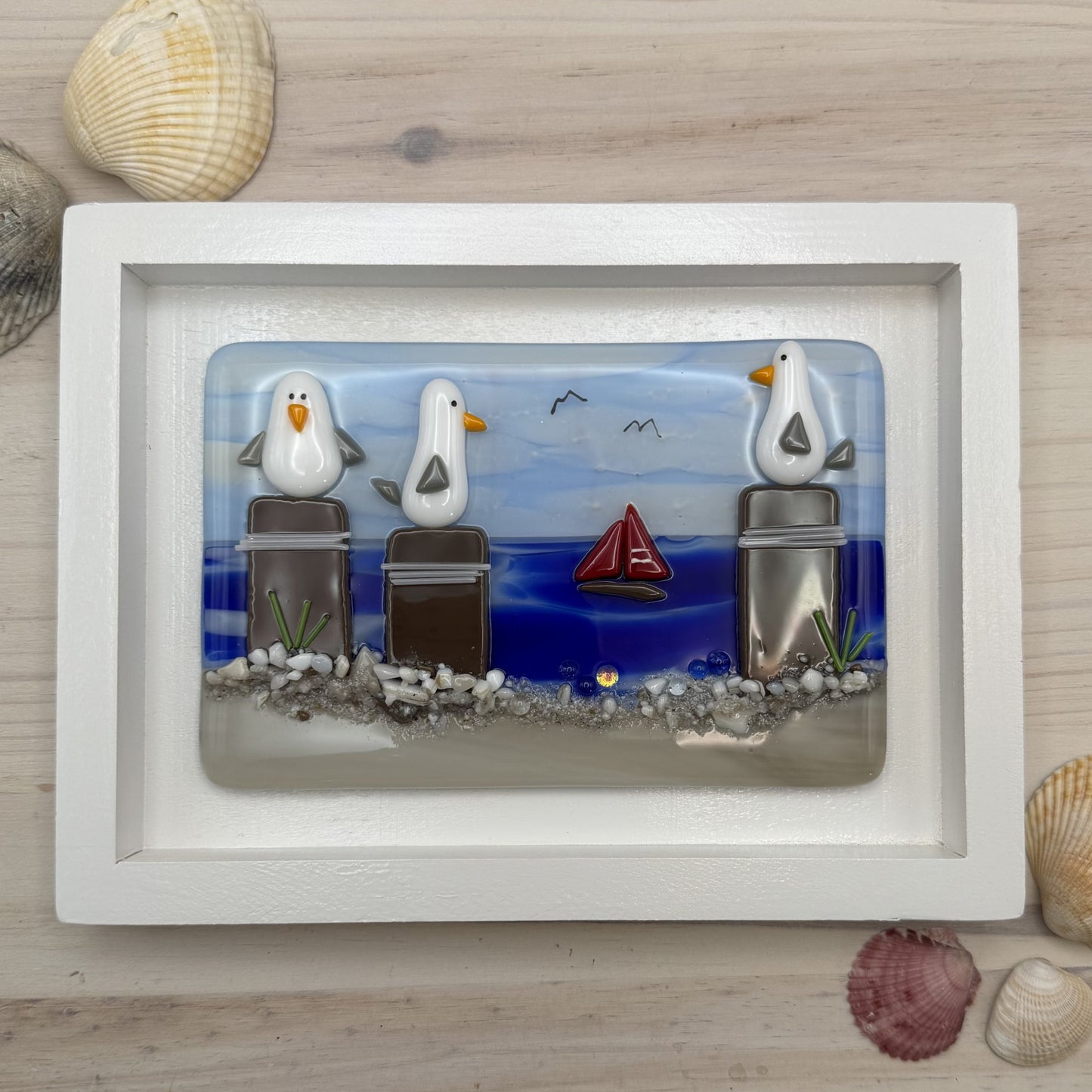 Playful Seagulls on Beach Pilings – Framed Fused Glass Coastal Art Panel