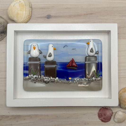 Playful Seagulls on Beach Pilings – Framed Fused Glass Coastal Art Panel