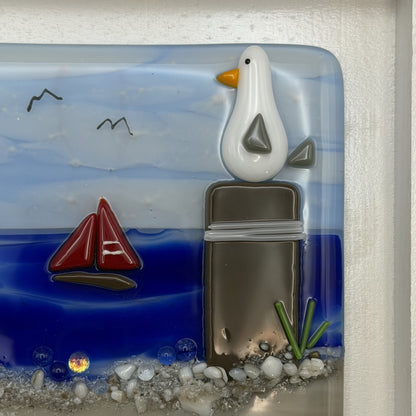 Playful Seagulls on Beach Pilings – Framed Fused Glass Coastal Art Panel