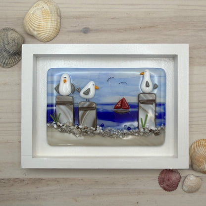 Playful Seagulls on Beach Pilings – Framed Fused Glass Coastal Art Panel