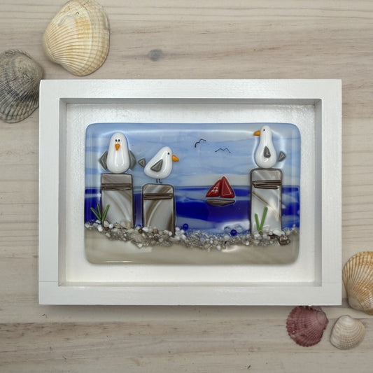 Playful Seagulls on Beach Pilings – Framed Fused Glass Coastal Art Panel